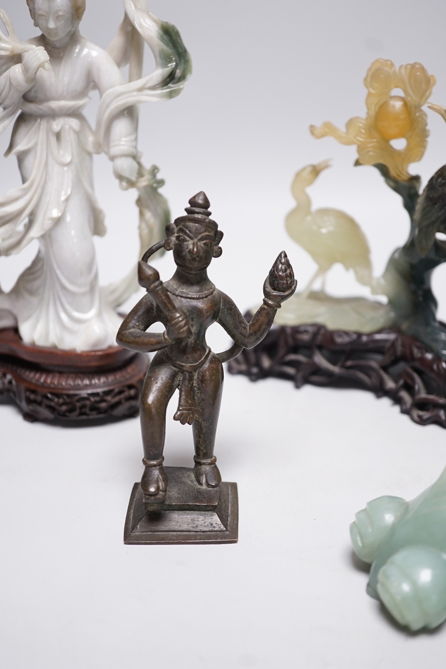 A Chinese bowenite jade bird group, together with a Jadeite figure of lady, 19.5cm high, a bowenite model of a goldfish, and an Indian brass figure